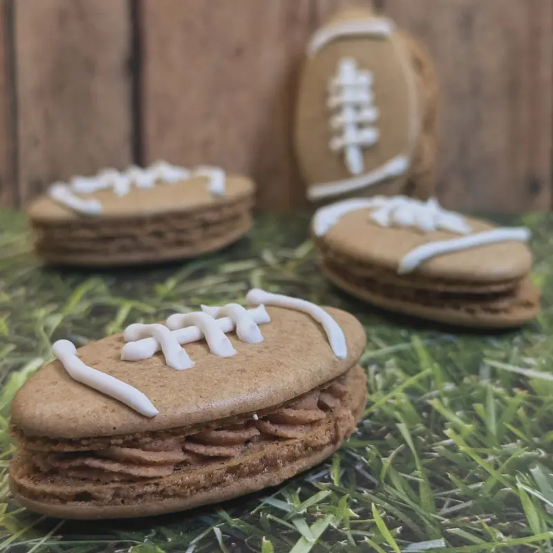 Cinnamon Ganache Football Macarons (With piped royal icing stitching)